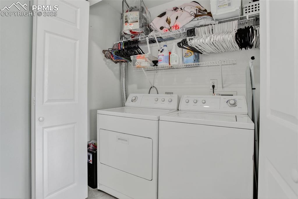 Upper level laundry near beds and bath