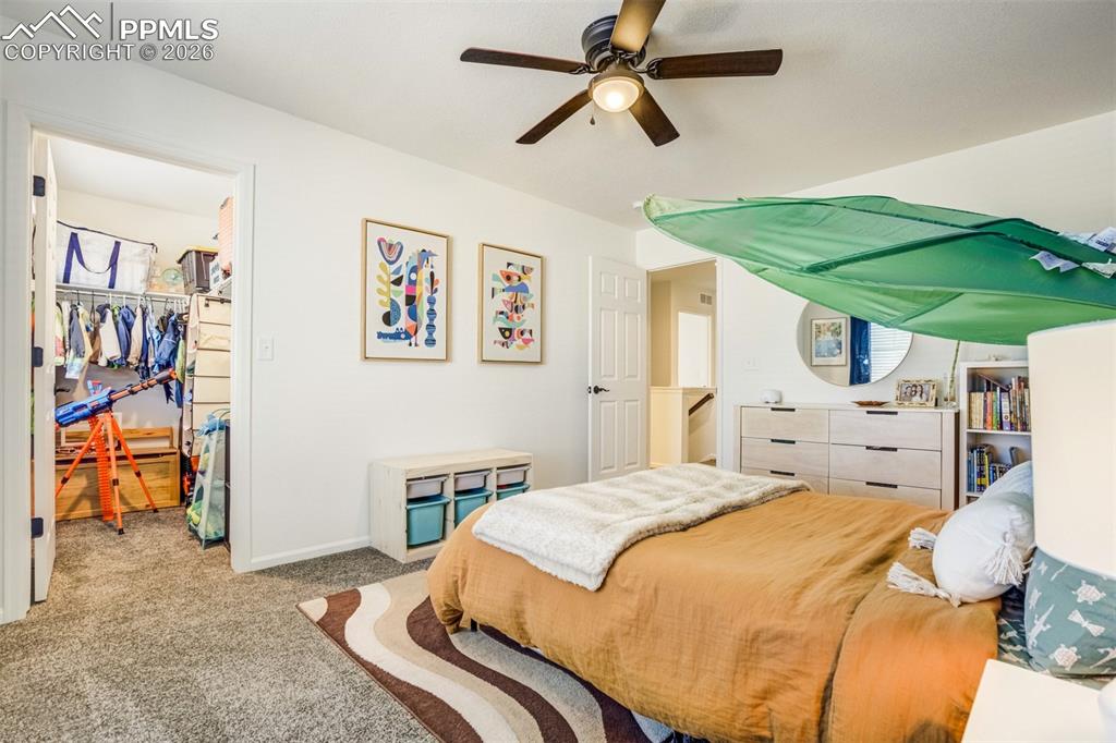 Walk-in closet & ceiling fan. 