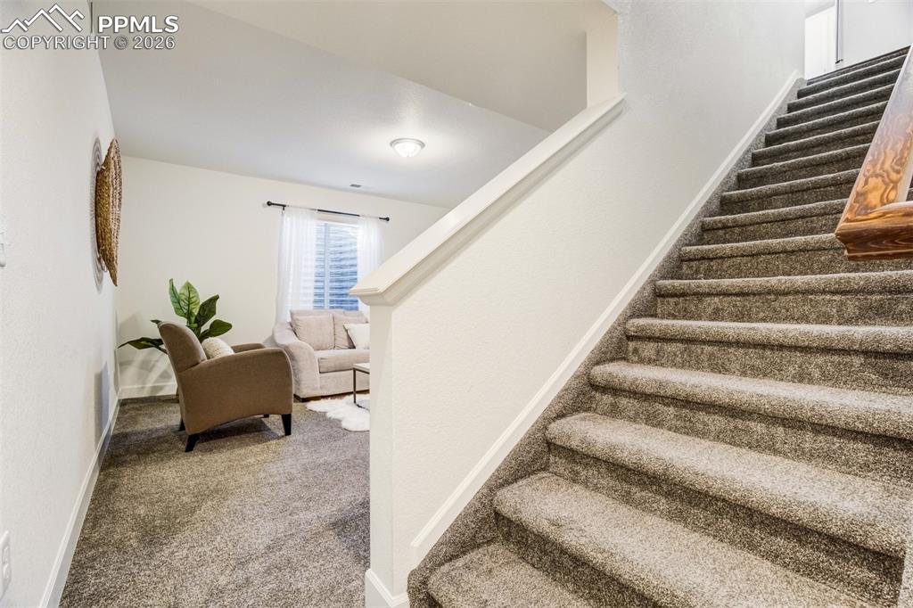 Head downstairs to the finished basement. 