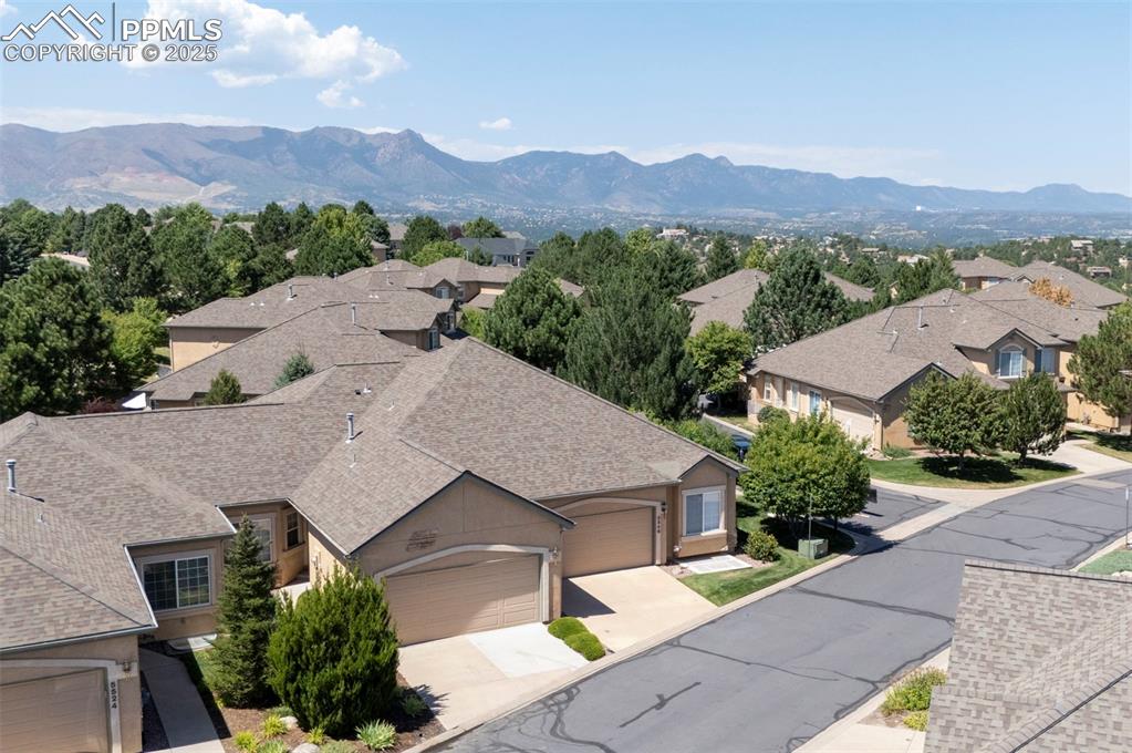 Aerial view of residential area featuring mountains