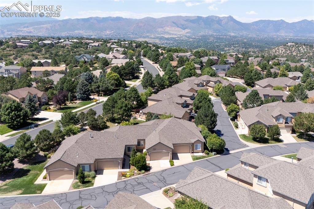Aerial perspective of suburban area featuring a mountainous background