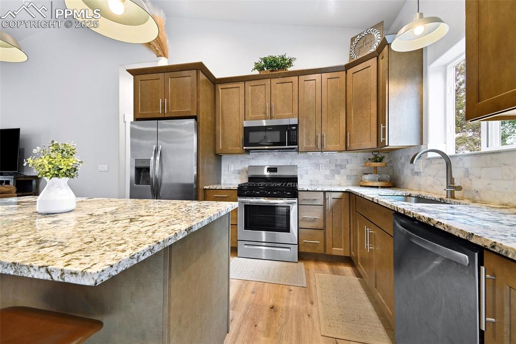 Granite Tops with Backsplash, Gas Range and Quality Cabinetry
