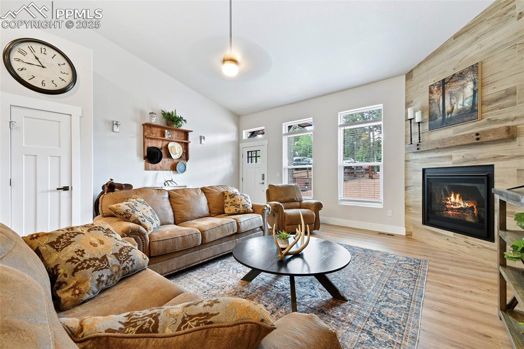 Well Designed Layout of Living Room and Interior Design Features. Vaulted Ceilings and an Abundance of Natural Light make this area warm and inviting.