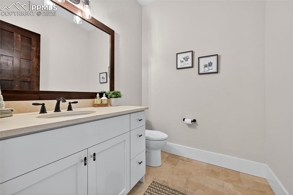 Bathroom with vanity and baseboards