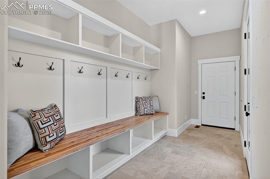 Mudroom with baseboards and recessed lighting