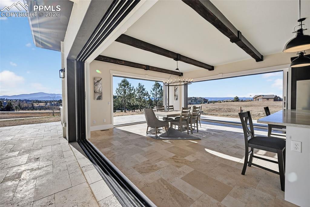 View of patio featuring outdoor dining area and a mountain view