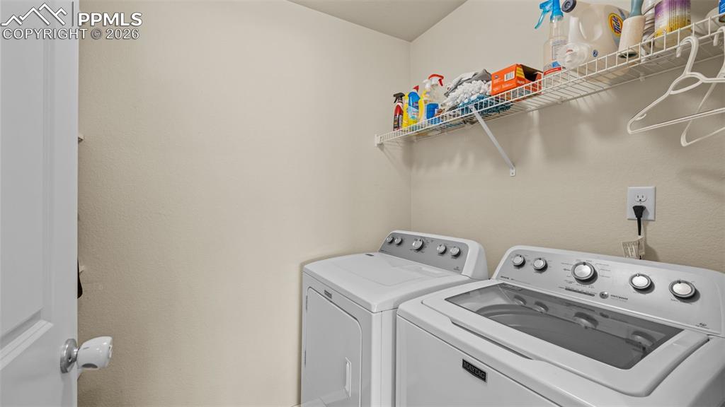 Laundry room featuring washer and clothes dryer