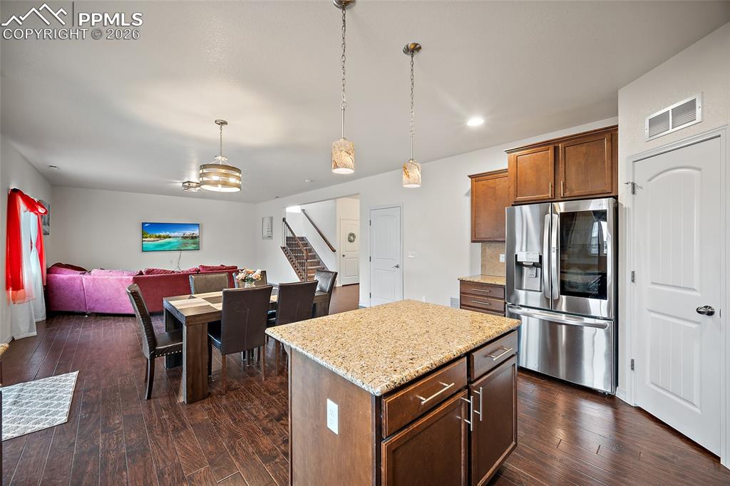 Corner pantry with tons of room for extra storage. Love the open Floor plan and beautiful wood flooring. 