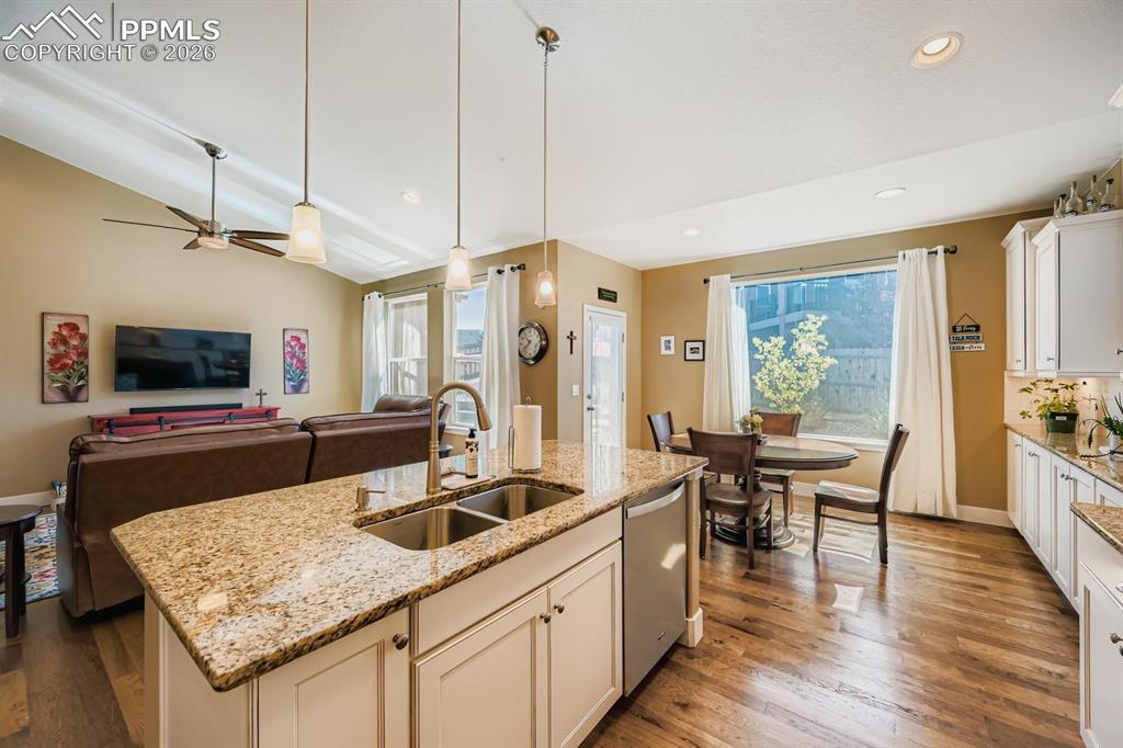 Solid slab granite counters with plenty of storage, workspace and pantry