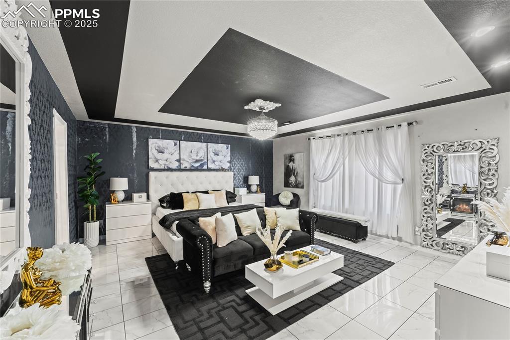 Bedroom featuring a tray ceiling