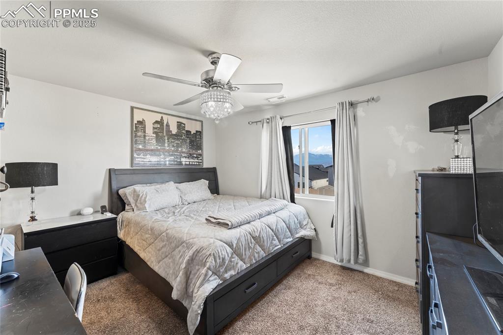 Bedroom featuring carpet flooring and ceiling fan