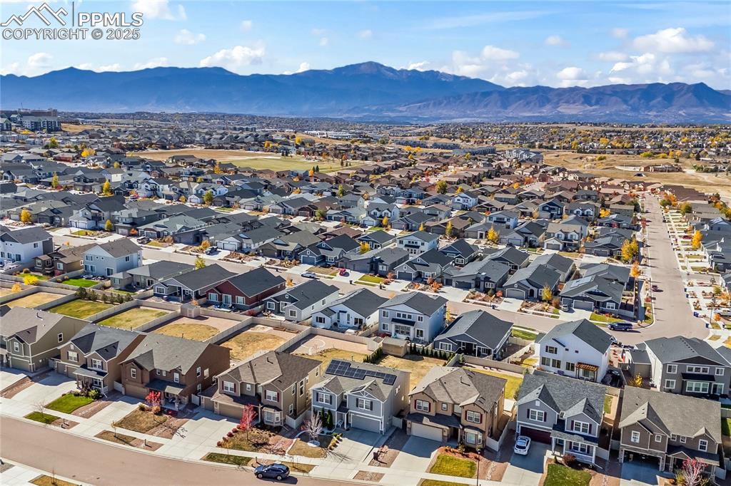 Aerial perspective of suburban area with a mountain backdrop