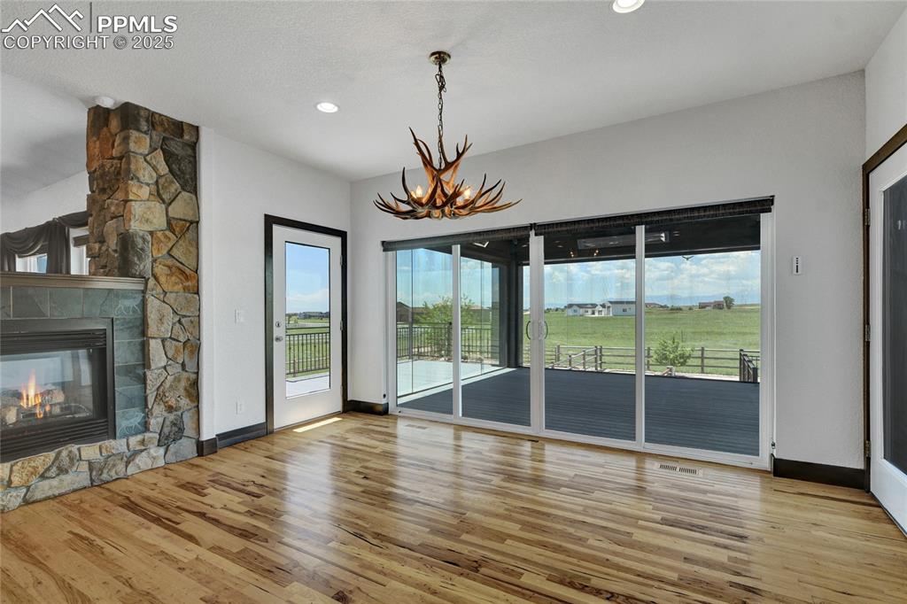 This dining space opens up to the 4 seasons sunroom which has heaters for year round comfort.