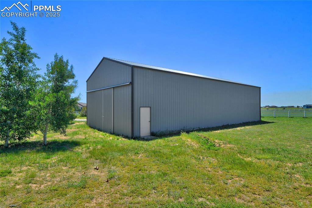 50x60 storage building with 3 12x14 overhead doors, one with an opener.  There is 1 220 Amp, a 12x12 finished room.  There is a second large building that could be used for so many things (currently an indoor basketball court)