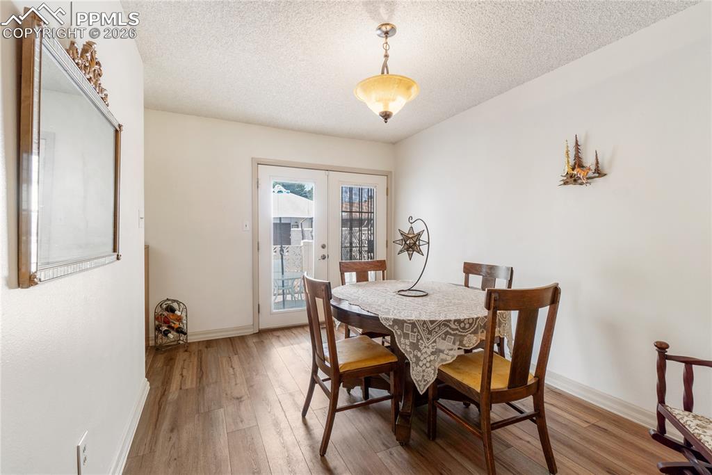 Dedicated dining area with walk-out to fenced in yard