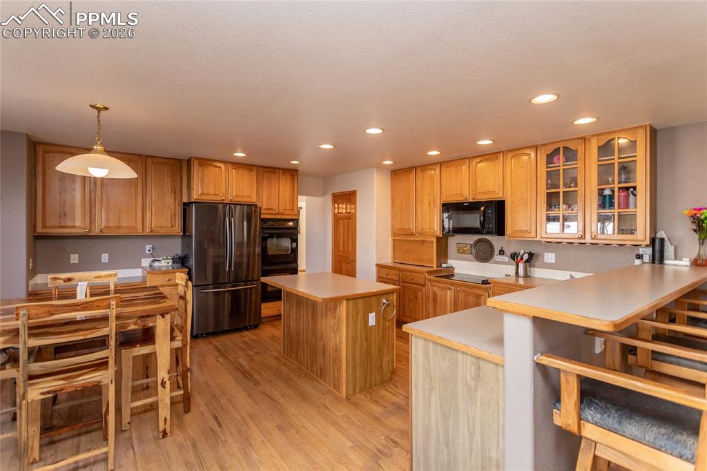 Eat-In Kitchen with a planning desk, island, breakfast bar and plenty of space for a traditional kitchen table.