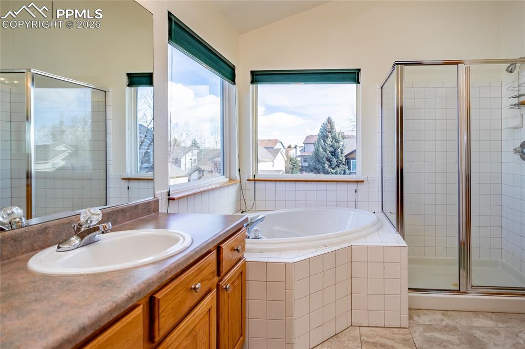 Relaxing deep corner tub. Walls have been fleshly painted. 