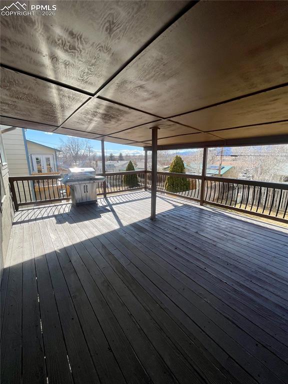 Deck featuring grilling area and a residential view