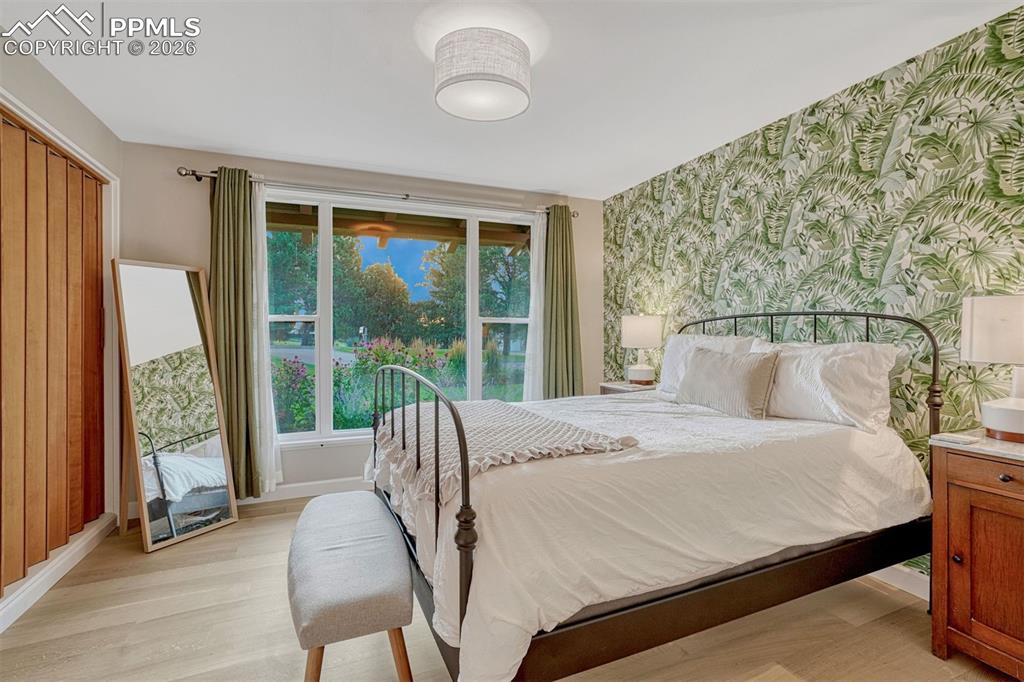 Bedroom with 6" white oak hardwood floors and closet organization system. 