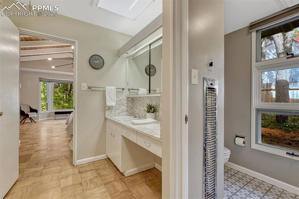 Vintage details and timeless appeal define this charming retro bathroom, meticulously maintained for everyday enjoyment