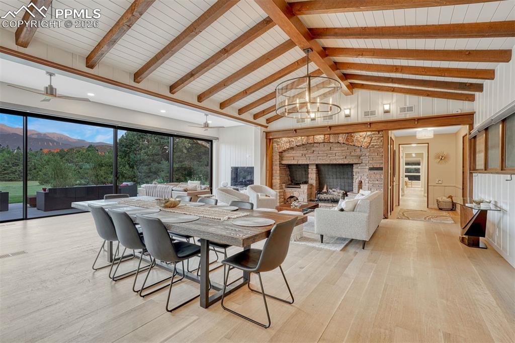 An open dining area flowing into the living room, with breathtaking views ideal for entertaining guests.