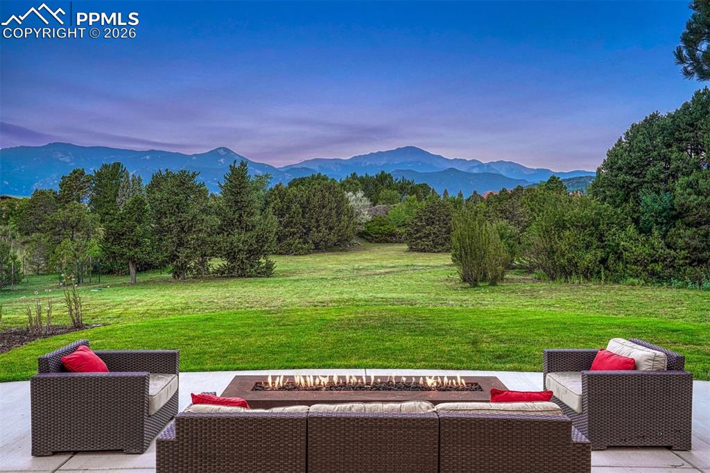 Rectangular corden steel gas firepit on the expansive patio