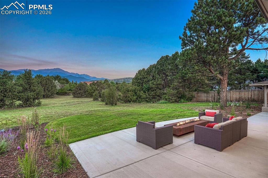 Gather around the rectangular firepit on the expansive patio, connected to the indoors through the dramatic NanaWall.