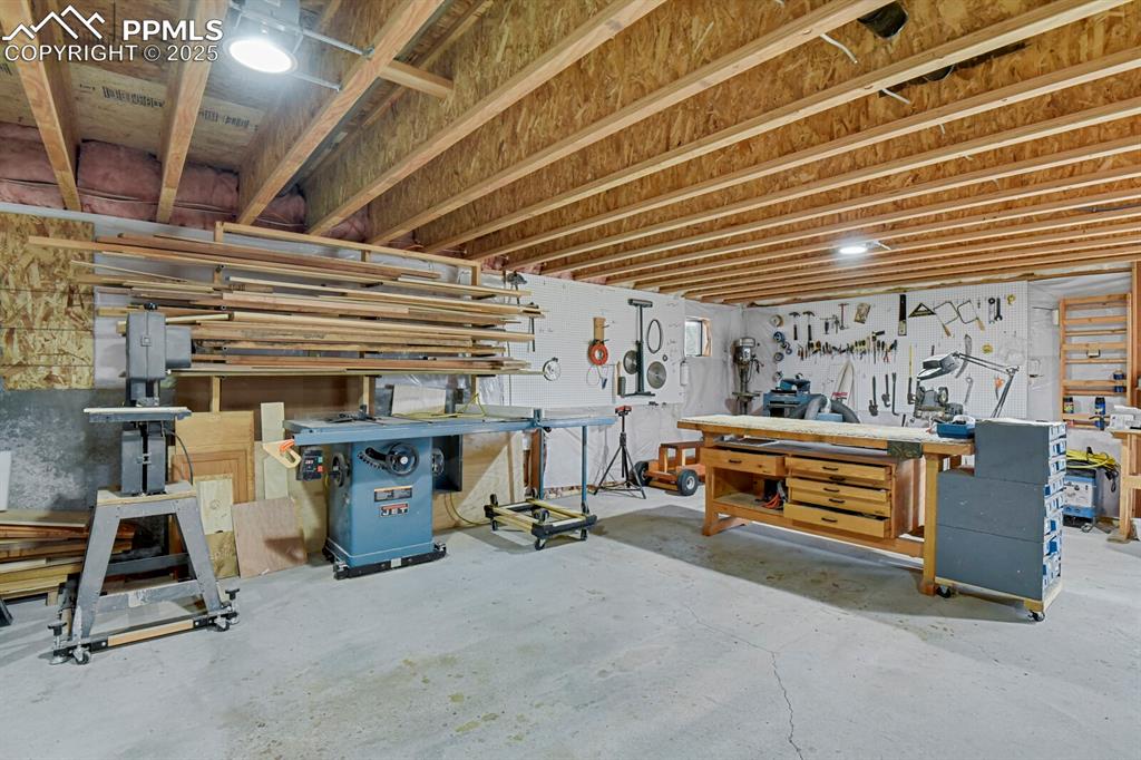 Below grade area with a workshop area