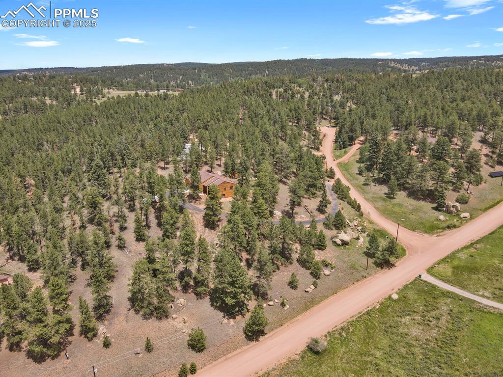 Aerial overview of property's location with a forest
