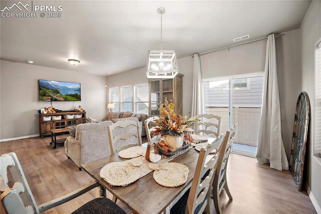 Dining area with walk out to fully fenced back yard and patio. 