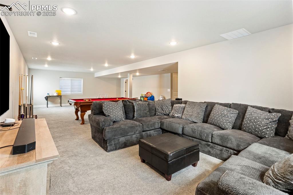 Living area with pool table, carpet floors, and recessed lighting