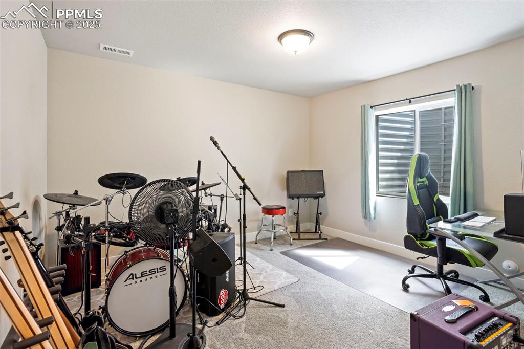Playroom featuring carpet floors and an office area
