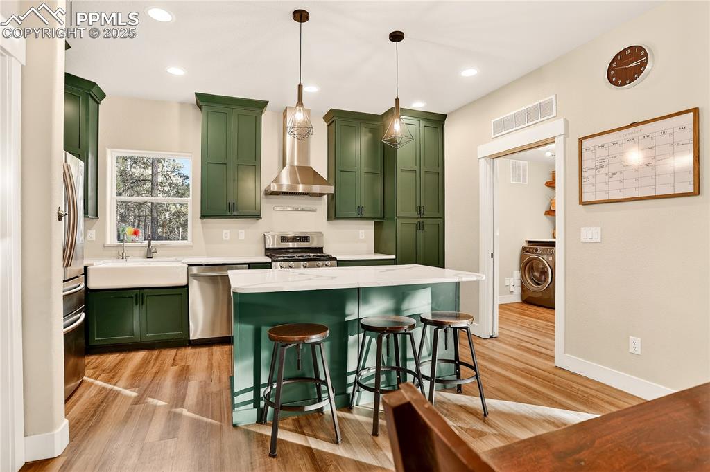 Gourmet kitchen with crown molding,  Samsung appliances and gas range