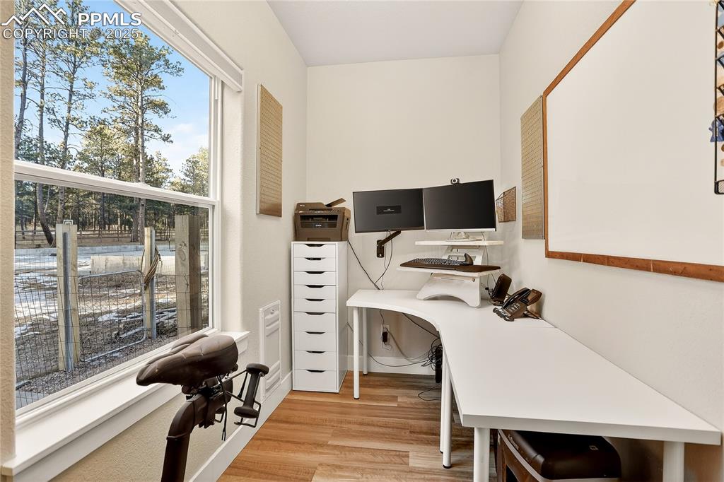 Main level office with large window makes it a pleasure to work from home.