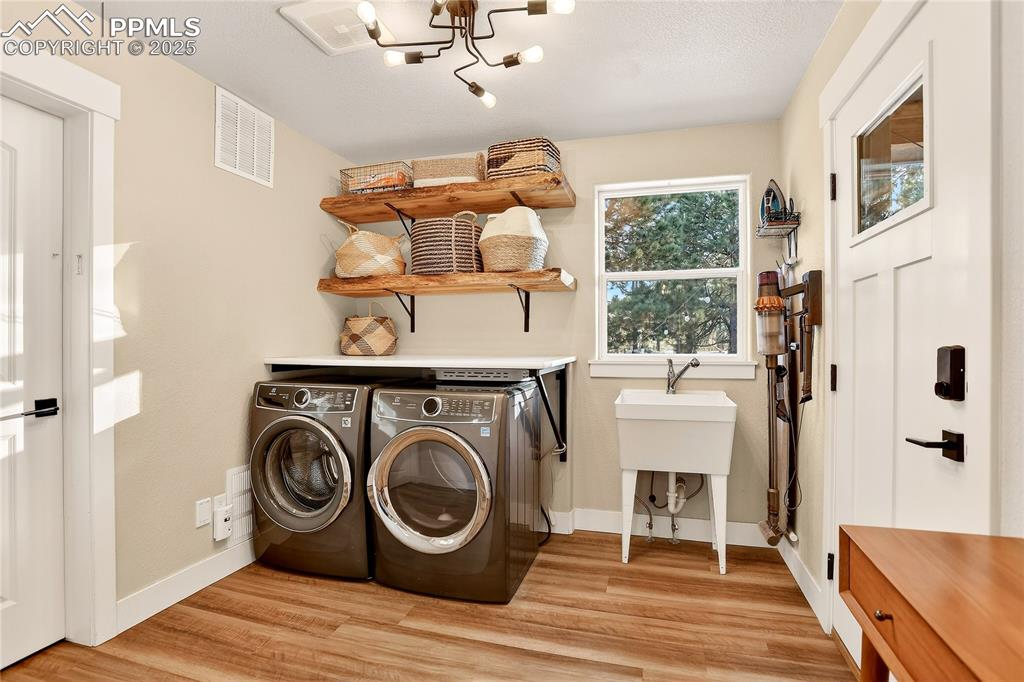 Spacious laundry walks out to the covered patio