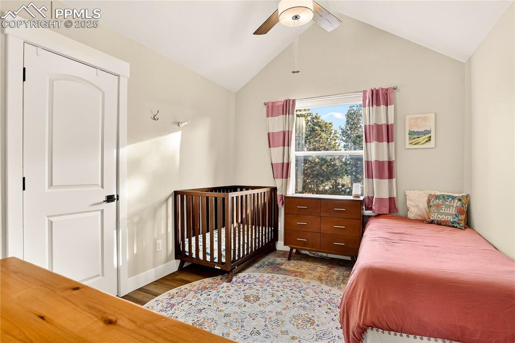 Bedroom 3 upstairs has it's own walk-in closet and window with a view of the forest