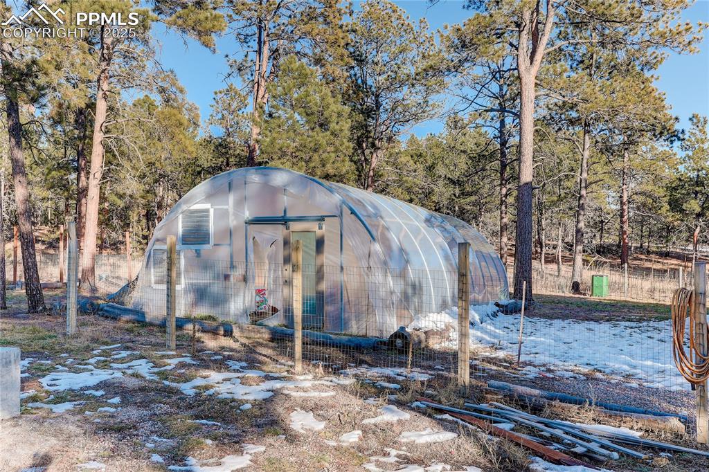 Fully enclosed greenhouse is a year-round gardener's paradise