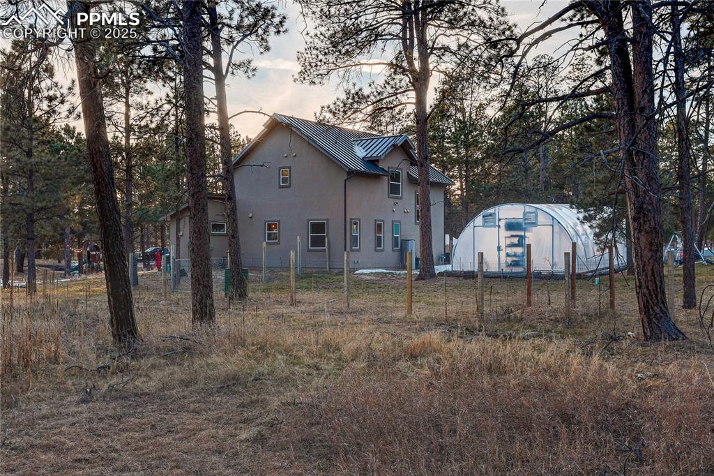 Dog Run: Expansive, fenced yard for your four-legged family members to romp safely, integrated into the same 1/2-acre perimeter with the chicken coop.