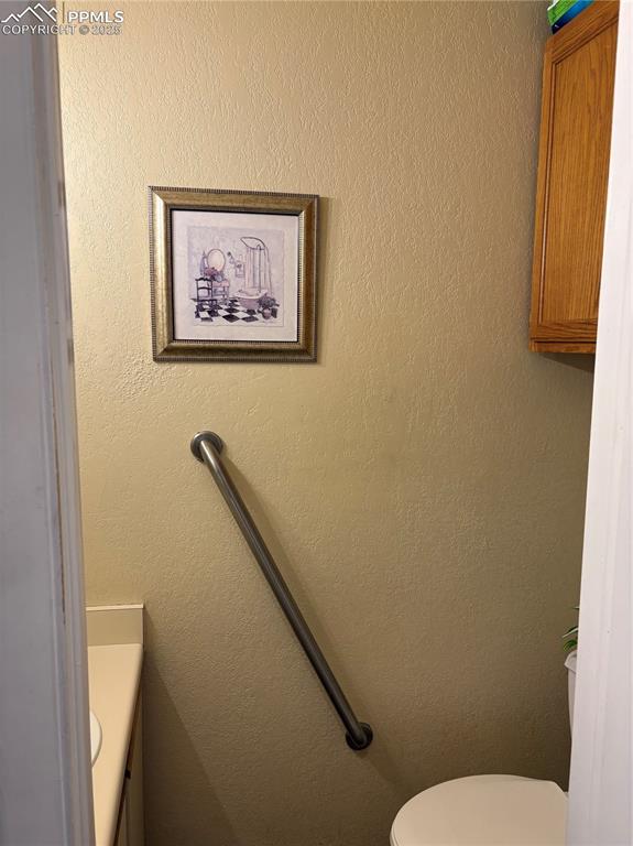 Bathroom with vanity and toilet