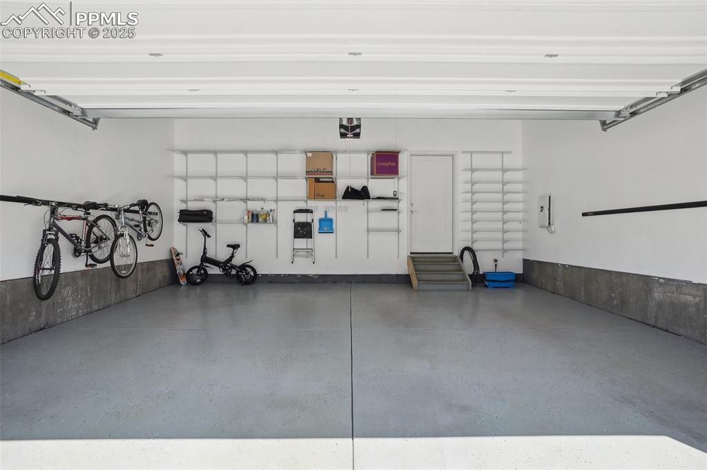 Large garage with shelving and wall racks