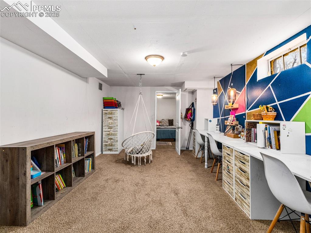 Office area featuring light colored carpet