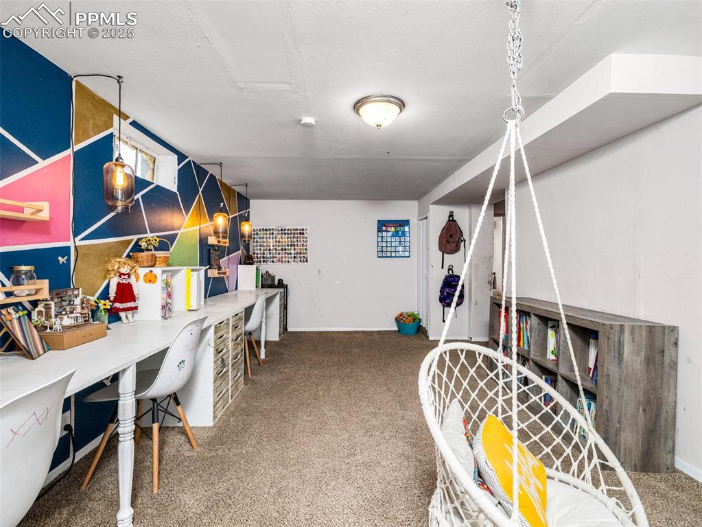 Playroom with carpet and an office area