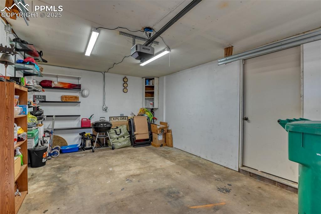 Garage featuring a garage door opener