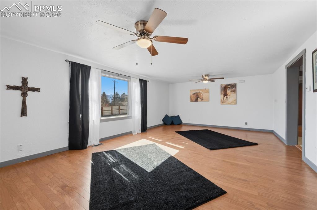 This grand living room can easily be divided into an additional bedroom. 