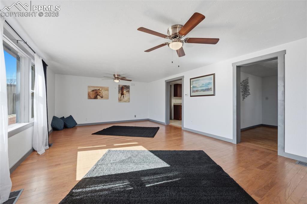 The living room is approx 23' x 15', new flooring, lights, paint, switches and curtains. 