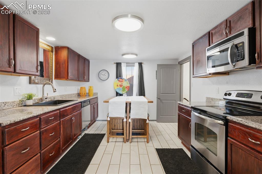 This 12' x 15' kitchen has been completely updated with new paint, new lights, newer tile and cabinets. 