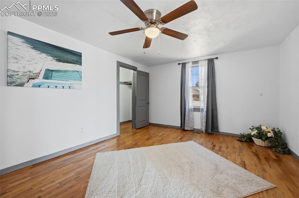 This primary bedroom has a walkin closet with a westerly facing windot looking out the front yard. 