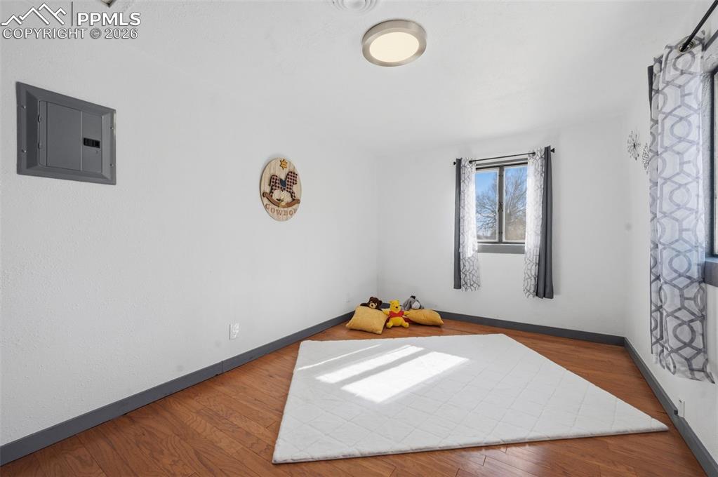 This is the 2nd bedroom located near the bathroom. Recently painted, trimmed, new lighting and new engineered hardwood flooring. 