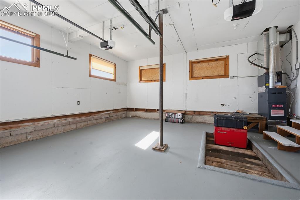 Recently the cement pad has been sealed with cement sealer and garage painted. This cute 2 car garage also has a mechanics bay built into the floor.