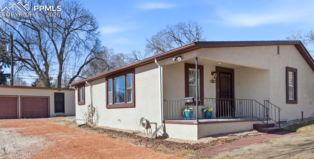 Massive 15,000 s/f lot with detached 2 car garage with a mechanics bay and ADU.